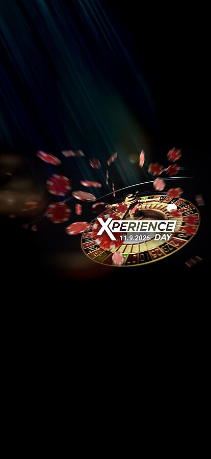 Roulette-Kessel mit fliegenden Jetons auf dunklem Hintergrund Xperience Day Key-Visual