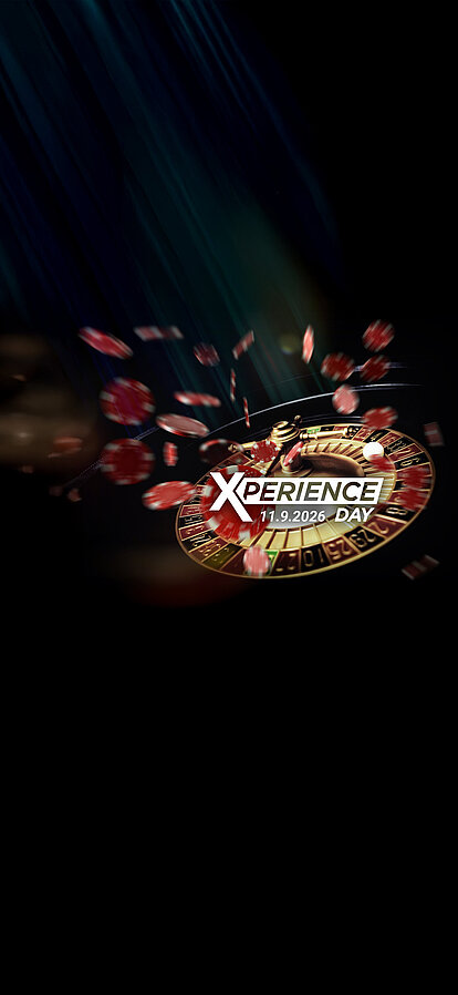 Roulette-Kessel mit fliegenden Jetons auf dunklem Hintergrund Xperience Day Key-Visual