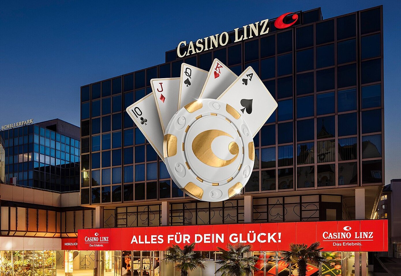 Aussenansicht des Casino Linz bei Nacht mit Pokerlogo