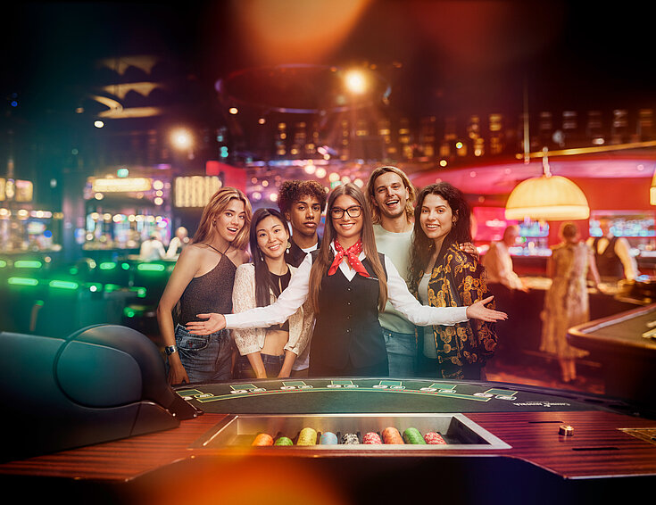 Casinos Austria Fun & Friends Table Gruppe mit Croupière am Black Jack Tisch