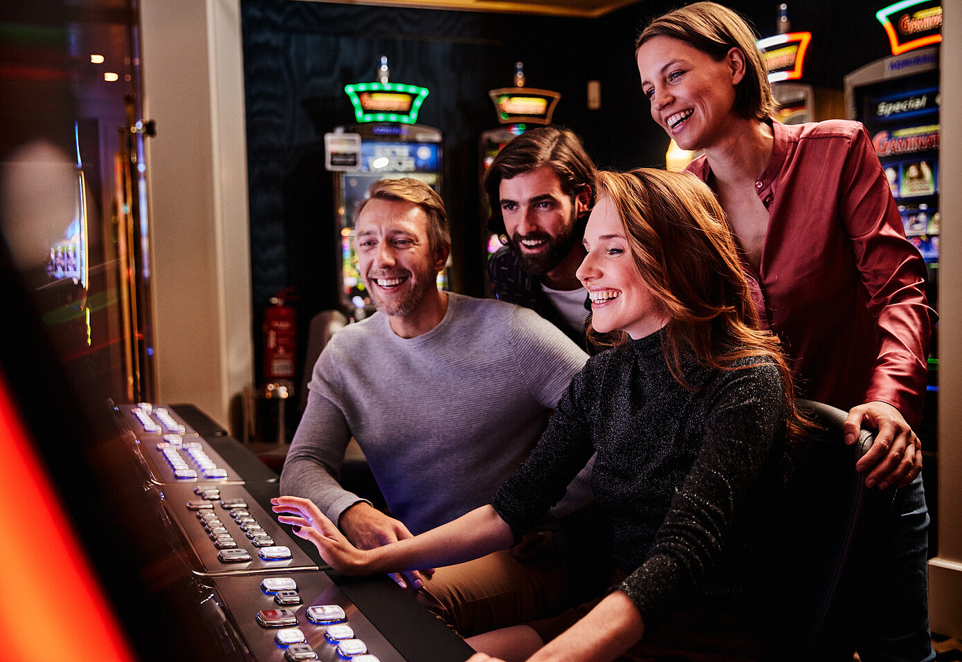 Two men and two women at the slot machine