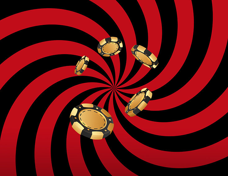 Goldene Jetons auf eine rot-schwarzem Hintergrund