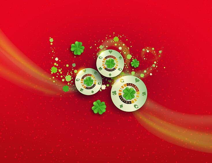 Casinos Austria und Shutterstock Tag des Glücks Kleeblatt-Jetons und Kleeblätter auf rotem Hintergrund